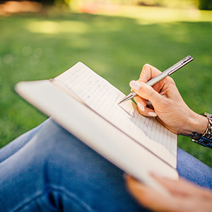 Woman writing outside