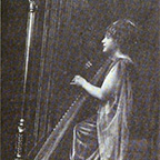 Ella Wheeler Wilcox playing the harp
